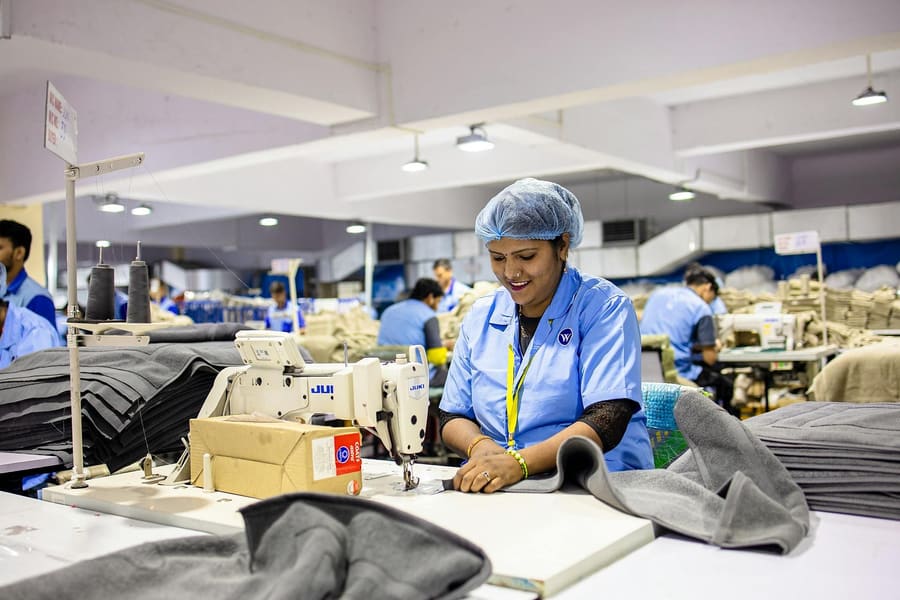 Operator stitching a garment